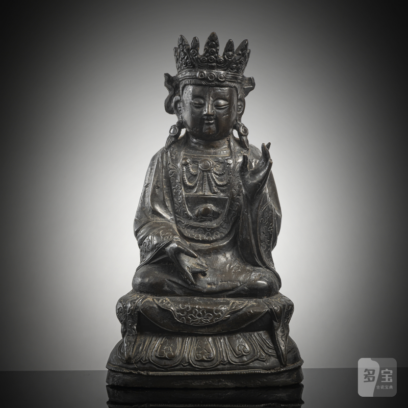 A bronze figure of a crowned Bodhisattva